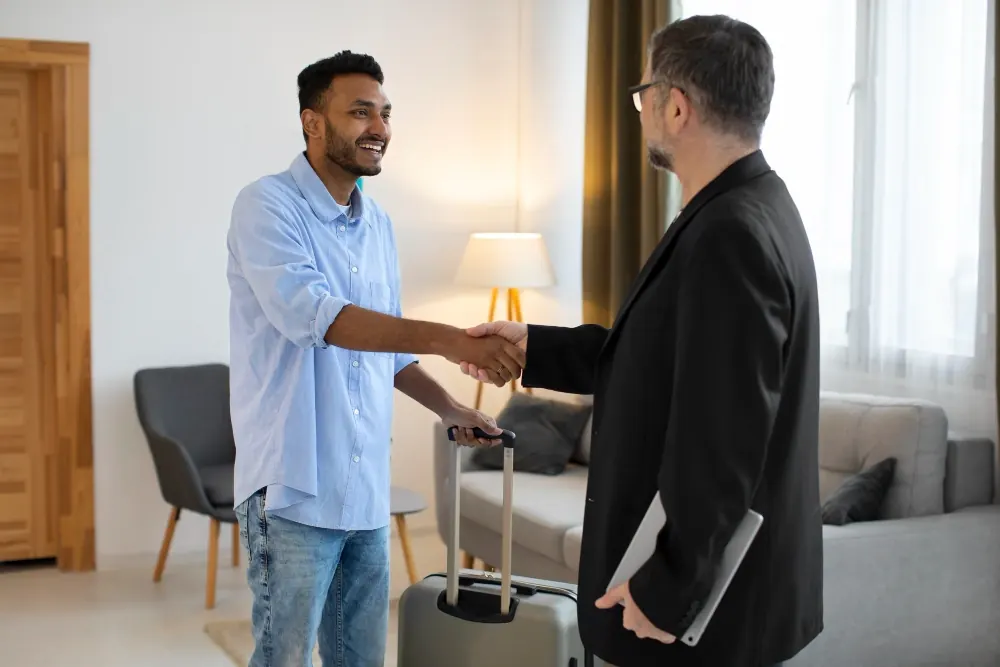 Hotel managers shaking hands on a revenue-strategy partnership